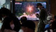 A South Korean soldiers walks past a TV broadcasting a news report on North Korea firing a ballistic missile towards the sea off its east coast, in Seoul, South Korea, on September 25, 2022. File Photo / Reuters
