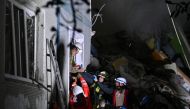 Rescuers carry a person out of a residential building heavily damaged by a Russian missile strike, amid Russia's attack on Ukraine, in Zaporizhzhia, Ukraine October 9, 2022. Reuters/Stringer