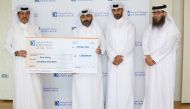 Officials from Doha Bank and Qatar Charity during the awarding of the QR1m donation in Doha, recently.   