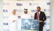 Dr. Sudheer Nair, Visa’s Country Manager for Qatar, and Braik Al Marri, Chief Retail Banking Officer at Doha Bank present the award to a FIFA World Cup campaign winner, in Doha, recently. 