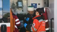 Paramedics help an injured man at a site of a Russian missile strike, amid Russia's attack on Ukraine, in Kiev, Ukraine, on October 10, 2022. REUTERS/Vladyslav Musiienko