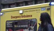 A woman passes a National Health Service ambulance in central London on January 6, 2015. File Photo / Reuters
