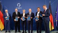 Michael Zissis Vassiliadis, Siegfried Russwurm, Veronika Grimm, German Chancellor Olaf Scholz, Economy Minister Robert Habeck and Finance Minister Christian Lindner hold the Independent Commission For Natural Gas and Heat proposal report at the Chancellery in Berlin, Germany, on October 10, 2022. REUTERS/Christian Mang