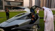 Guests and reporters check out the XPeng eVTOL flying car X2 in Dubai, United Arab Emirates, on October 10, 2022. REUTERS/Amr Alfiky