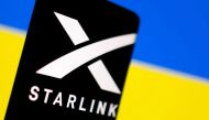 Starlink logo is seen on a smartphone in front of displayed Ukrainian flag in this illustration taken on February 27, 2022.   File Photo / Retuers


