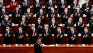 Chinese President Xi Jinping waves as he arrives for the opening ceremony of the 20th National Congress of the Communist Party of China, at the Great Hall of the People in Beijing, China October 16, 2022. Reuters/Thomas Peter 