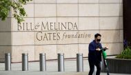 A person passes by on a scooter in front of the Bill & Melinda Gates Foundation in Seattle, Washington, US, on May 5, 2021.  File Photo / Reuters