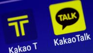 The Kakao messaging application and the Kakao T taxi booking application are seen on a mobile phone in this illustration photo March 13, 2018. REUTERS/Thomas White/Illustration/File Photo