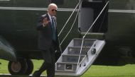 US President Joe Biden walks across the South Lawn after arriving on Marine One from Delaware at the White House in Washington, US, on October 17, 2022. REUTERS/Leah Millis