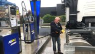 Truck driver Antonio Perreira, employee of FDE Transports, fills his fuel tank at a gas station dedicated to transport professionals in Mitry-Mory near Paris as refinery strikes in France continue to affect gas stations, France, on October 17, 2022. REUTERS/Caroline Pailliez