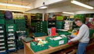 A man works at The DENS charity food bank, as the spread of the coronavirus disease (COVID-19) continues, in Hemel Hempstead, Britain, March 25, 2020. REUTERS/Paul Childs/File Photo