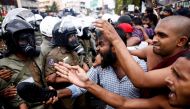 Demonstrators shout at Sri Lankan police officers during an anti-government protest of the Inter University Students' Federation amid the country's soaring economic crisis, in Colombo, Sri Lanka, October 18, 2022. (REUTERS/Dinuka Liyanawatte)