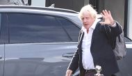Former British Prime Minister Boris Johnson walks, at Gatwick Airport, near London, Britain, on October 22, 2022. REUTERS/Henry Nicholls