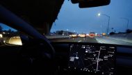 A Tesla Model 3 vehicle drives on autopilot along the 405 highway in Westminster, California, US, March 16, 2022. (REUTERS/Mike Blake)