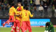 Zimbabwe's players celebrate their victory as Pakistan's Mohammad Wasim (right) reacts at the end of the ICC men's Twenty20 World Cup 2022 cricket match between Pakistan and Zimbabwe in Perth on October 27, 2022. (TREVOR COLLENS/AFP)