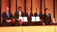 Qatar and Japan officials during the signing ceremony. 
