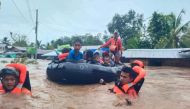 Philippine Coast Guard (PCG) rescuers evacuate residents from their flooded homes due to a tropical storm, locally named Paeng, in Maguindanao province, Philippines, October 28, 2022. Philippine Coast Guard/Handout via REUTERS