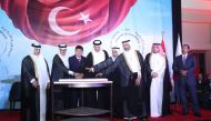 L-R: Minister of Municipality H E Dr. Abdullah bin Abdulaziz bin Turki Al Subaie; Minister of State and President of Qatar National Library H E Dr. Hamad bin Abdul Aziz Al Kawari; Ambassador of Türkiye to Qatar H E Dr. Mustafa Göksu; Speaker of Shura Council H E Hassan bin Abdullah Al Ghanim;  Minister of Awqaf and Islamic Affairs H E Ghanem bin Shaheen bin Ghanem Al Ghanim; Minister of Environment and Climate Change H E Sheikh Dr. Faleh bin Nasser bin Ahmed Al Thani; MoFA Chief of Protocol, H E  Ambassador Ibrahim Yousef Fakhroo and Ambassador of Eritrea, Dean of the Diplomatic Corps, H E Ali Ibrahim, during a cake-cutting ceremony to mark the 99th anniversary of the Republic of Türkiye.