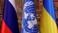 Flags of Russia, the United Nations and Ukraine are seen on the day of a signing ceremony in Istanbul, Turkey July 22, 2022. (REUTERS/Umit Bektas)