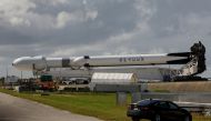 A SpaceX Falcon Heavy rocket with a long-delayed national security payload for the U.S. Space Force, rolls to launch pad 39A at NASA's Kennedy Space Center in Cape Canaveral, Florida, US, on October 31, 2022. Launch is scheduled for November 1. REUTERS/Joe Skipper