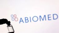 A vial is seen in front of displayed Abiomed logo in this illustration taken December 1, 2021. (REUTERS/Dado Ruvic)

