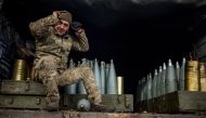 A Ukrainian artilleryman sits in a military truck at a position on the front line near the town of Bakhmut, in eastern Ukraine's Donetsk region, on October 31, 2022, amid the Russian invasion of Ukraine. (Photo by Dimitar DILKOFF / AFP)