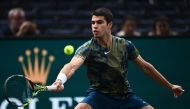 Spain's Carlos Alcaraz Garfia plays a forehand return during the men's singles round of 16 tennis match between Spain's Carlos Alcaraz Garfia and Japan's Yoshihito Nishioka on day three of the ATP World Tour Masters 1000 - Paris Masters (Paris Bercy) - indoor tennis tournament at The AccorHotels Arena in Paris on November 2, 2022. (Photo by Christophe ARCHAMBAULT / AFP)
