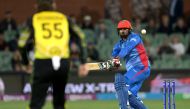 Afghanistan's Captain Mohammad Nabi plays a shot in the air and is out during the ICC men's Twenty20 World Cup 2022 cricket match between Australia and Afghanistan at Adelaide Oval on November 4, 2022 in Adelaide. (AFP/Brenton EDWARDS)