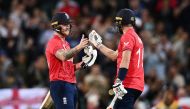 England's Chris Woakes and Ben Stokes celebrate after winning the match Dan Himbrechts/AAP Image via Reuters