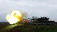 Ukrainian soldiers fire a round on the frontline from a T80 tank that was captured from Russians during a battle in Trostyanets in March, as Russia's invasion of Ukraine continues, in the eastern Donbas region of Bakhmut, Ukraine, on November 4, 2022. REUTERS/Clodagh Kilcoyne