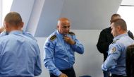 Police officers take off their uniforms following local Serbs' decision to leave Kosovo institutions, in Zvecan, Kosovo, on November 5, 2022. REUTERS/Ognen Teofilovski