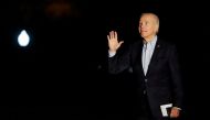 US President Joe Biden gestures to first lady Jill Biden after disembarking from Marine One on return to the White House in Washington, US, November 6, 2022. REUTERS/Elizabeth Frantz