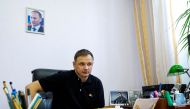In this file photo taken on July 20, 2022 Kirill Stremousov, deputy head of the Russian-backed Kherson administration, is pictured in his office, with a portrait of Russian President Vladimir Putin seen on the wall behind him, in the city of Kherson, amid the ongoing Russian military action in Ukraine.  (Photo by STRINGER / AFP)
