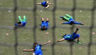 Pakistan players stretch during a training session in Melbourne on November 11, 2022, ahead of their ICC men's Twenty20 World Cup 2022 final cricket match against England on November 13. Photo by William West / AFP
