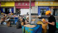 A delivery worker sorts parcels at a makeshift logistics station ahead of Alibaba's Singles' Day shopping festival, following the coronavirus disease (COVID-19) outbreak in Shanghai, China, November 10, 2022. Reuters/Aly Song