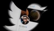 Elon Musk twitter account is seen through Twitter logo in this illustration. (REUTERS/Dado Ruvic)