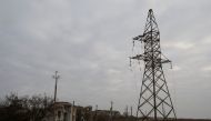 A views shows houses and a pylon with high-voltage wires damaged during Russian military attacks in the village of Osokorivka, in Kherson region, Ukraine, on November 9, 2022. REUTERS/Valentyn Ogirenko/File Photo