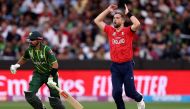 England's Chris Woakes reacts as Pakistan's Captain Babar Azam (L) runs between the wickets during the ICC men's Twenty20 World Cup 2022 cricket final match between England and Pakistan at the Melbourne Cricket Ground (MCG) on November 13, 2022 in Melbourne. Photo by Martin Keep/ AFP