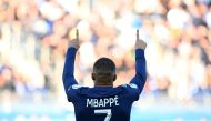 Paris Saint-Germain's French forward Kylian Mbappe celebrates after scoring his team's first goal during the French L1 football match between Paris Saint-Germain FC and AJ Auxerre at the Parc des Princes stadium in Paris on November 13, 2022. (AFP/Franck Fife)