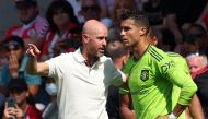In this file photo taken on August 27, 2022 Manchester United's Dutch manager Erik ten Hag (L) directs substitute Manchester United's Portuguese striker Cristiano Ronaldo during the English Premier League football match between Southampton and Manchester United at St Mary's Stadium in Southampton, southern England. (Photo by Adrian DENNIS / AFP) 