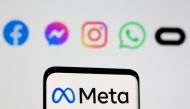 The Meta logo on smartphone in front of logo of Facebook, Messenger, Instagram, WhatsApp, Oculus in this illustration picture taken October 28, 2021. File Photo / Reuters