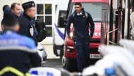 France's national football team defender Raphael Varane (centre) arrives at Le Bourget airport near Paris, on November 16, 2022, upon the team's departure for the 2022 FIFA World Cup in Qatar. (Photo by Christophe ARCHAMBAULT / AFP)