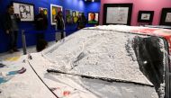 An exibit is covered in flour after climate activists of ''Ultima Generazione (Last Generation)