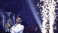 Serbia's Novak Djokovic celebrates with the trophy after winning the men's singles final of the ATP Finals against Norway's Casper Ruud Turin in Pala Alpitour, Turin, Italy, on November 20, 2022.  REUTERS/Guglielmo Mangiapane
 