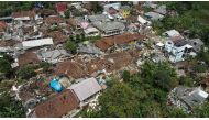 An aerial view of badly damaged houses following Monday's earthquake in Cianjur, November 23, 2022, in this photo taken by Antara Foto. Antara Foto/Raisan Al Farisi via Reuters 