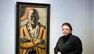 Micaela Kapitzky, director and partner of Berlin's Grisebach auction house, poses next to the painting 