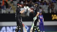New Zealand's captain Kane Williamson (L) and Tom Latham celebrate during the first one-day international cricket match between New Zealand and India at Eden Park in Auckland on November 25, 2022. Photo by David Rowland / AFP