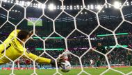 Poland's Wojciech Szczesny saves a penalty from Saudi Arabia's Salim Al Dawsari. File photo.