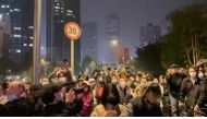 Protesters chant slogans in support of freedom of speech and the press, amid broader nationwide unrest due to COVID-19 lockdown policies, in Chengdu, China in this still image obtained from undated social media video released November 27, 2022. (Reuters)