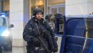 Police officers secure the area at a Christmas market in Dresden, Germany, December 10, 2022. Reuters/Matthias Rietschel